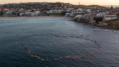 Hundreds honour Westfield stabbing victims with paddle-out at Bondi beach - video