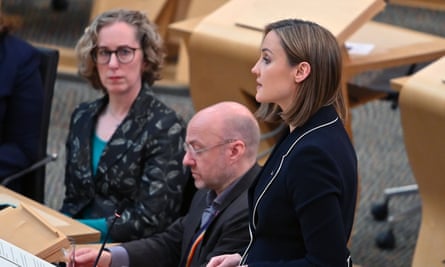 Màiri McAllan speaks in the Scottish parliament with Lorna Slater and Patrick Harvie to her side