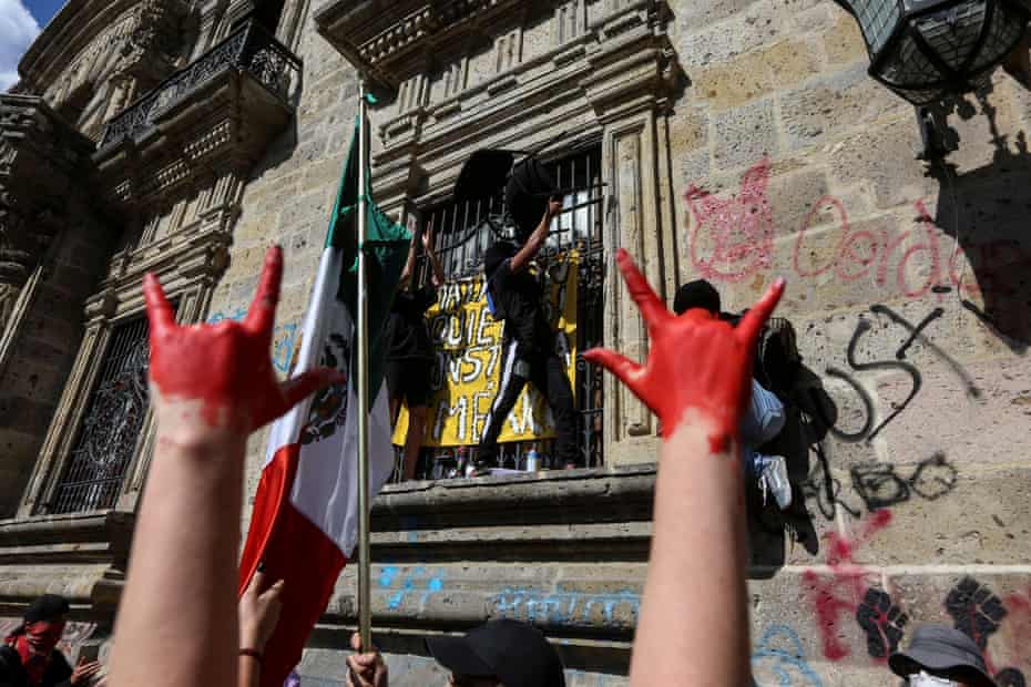 Demonstrators protest outside of Jalisco State Government Palace to demand justice for Giovanni Lopez, a construction worker who died after being arrested for not wearing a face mask in public.