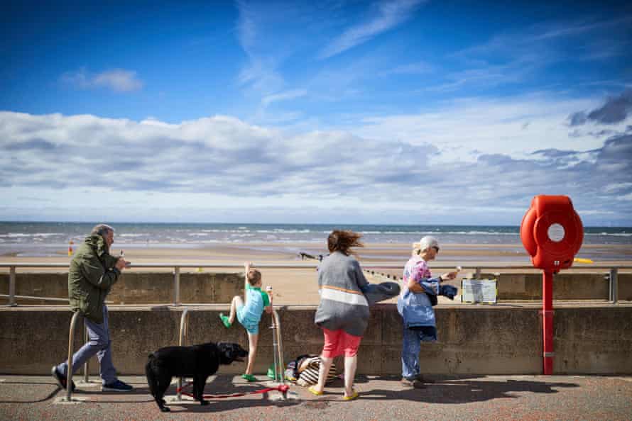 4 August – Sunshine on the beach at Rhyl on the north Wales coast, where unemployment had nearly doubled since the start of the lockdown