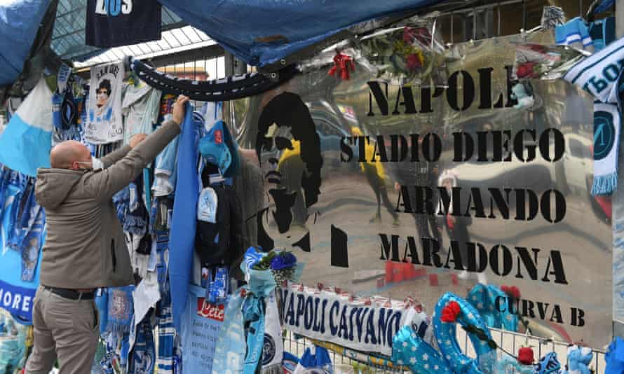 Tributes and an unofficial sign outside the stadium in Naples.