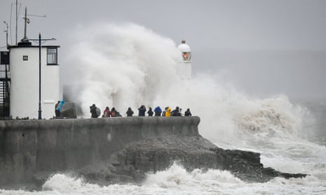 Rough seas pound against the harbour wall at Porthcawl, Wales. 