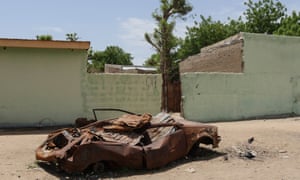 Fresh plaster on Bama’s walls hides incomplete reconstruction.
