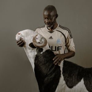 Joseph Ki-Zerbo, an 18-month-old ladoum ram from the Vizuri flock, with owner and breeder Mohamed Seck