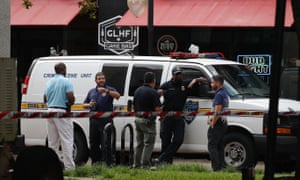 Officials investigate the shooting at GLHF Game Bar, where the tournament was livestreamed on Twitch, on 27 August.