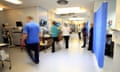 Blurred, time-lapse image of staff on an NHS hospital ward