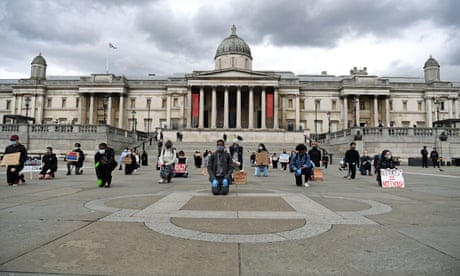 People kneeling at a protest in Trafalgar Square, London, on 5 June 2020