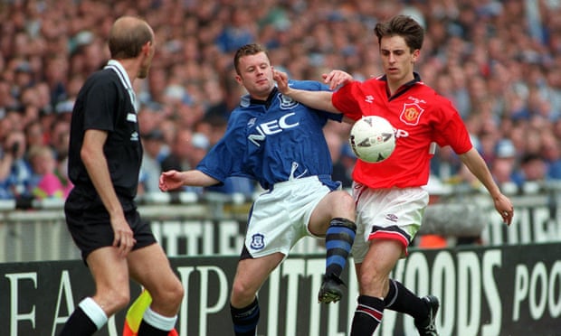 Gary Neville takes on Everton’s Graham Stuart