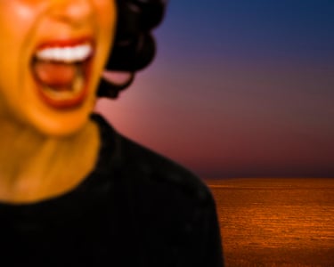 close-up of woman’s face yelling with sunset over water in background