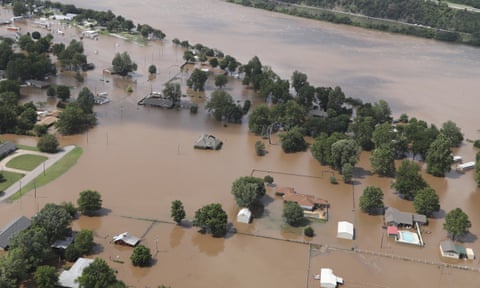 Homes are inundated with flood waters from the Arkansas river in Sand Springs, Oklahoma.