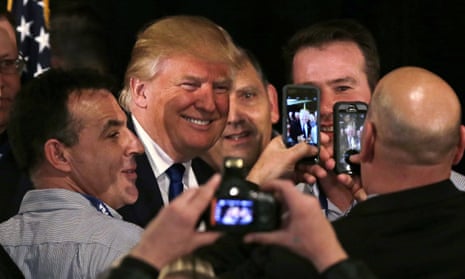 Donald Trump has his photograph taken with supporters after being endorsed at a regional police union meeting in Portsmouth, New Hampshire on Thursday.