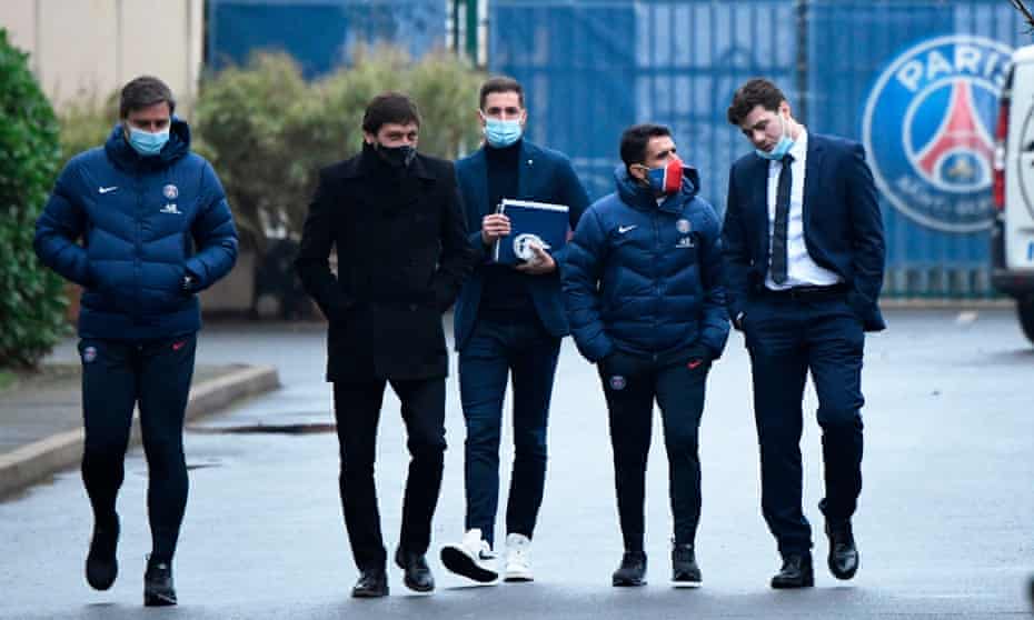 Mauricio Pochettino (right) walks with Paris Saint-Germain’s sporting director Leonardo (second-left) and staff members as he leaves after a training session and his official presentation at the team’s training facility in Saint-Germain-en-Laye.