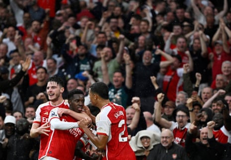 Arsenal's Eddie Nketiah celebrates scoring their second goal against Fulham with Declan Rice and William Saliba.