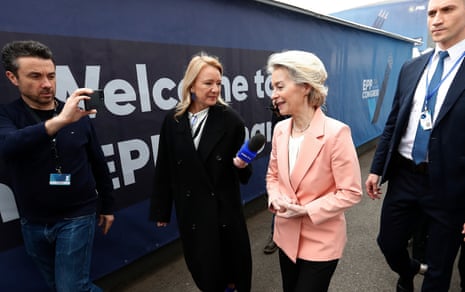 European Commission president Ursula von der Leyen (C-R) talks to TV reporters as she arrives for the European People's party congress in Bucharest, Romania, on Wednesday.