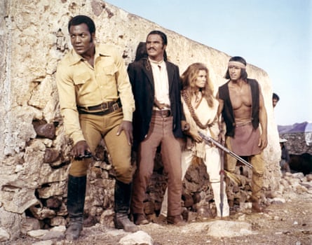 Jim Brown, left, with, from left, Burt Reynolds, Raquel Welch and Michael Forrest in 100 Rifles, 1969.
