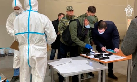 Investigators from the Investigative Committee of Russia together with the operational units of the Ministry of Internal Affairs and the FSB, work on actions at the scene after a terrorist attack on the building of the Crocus City Hall.