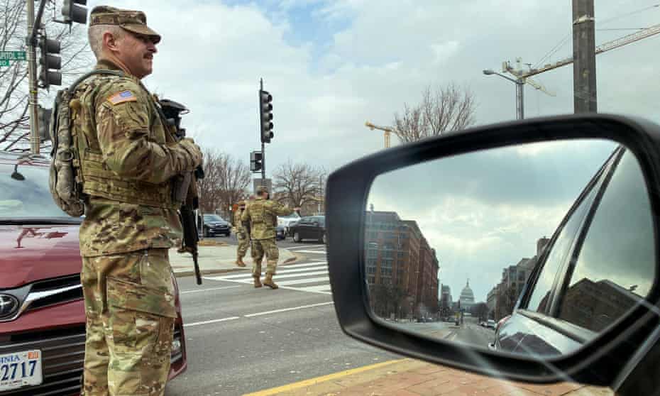 US national guard soldiers staff a checkpoint a few blocks from the Capitol. Security measures have been dramatically strengthened.