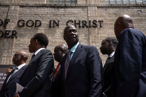 a group of men standing outside a national monument