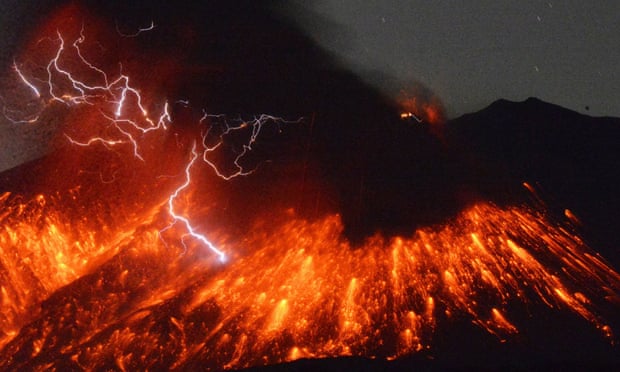 Lightning flashes above flowing lava as Sakurajima erupts in southern Japan. Photograph: AP