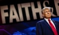 Trump on stage in front of a large sign saying 'Faith'