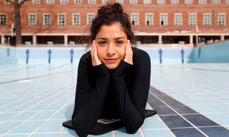 Syrian refugee and Olympic swimmer Yusra Mardini poses for the photographer after a training session in a pool at the Olympic park in Berlin, Germany, April 12, 2018. Picture taken April 12, 2018. REUTERS/Fabrizio Bensch