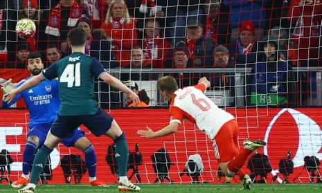 Bayern Munich's Joshua Kimmich scores their winner past Arsenal's keeper David Raya.