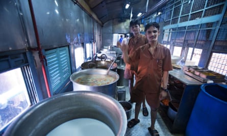 Kitchen staff cook on an Indian Railways train.