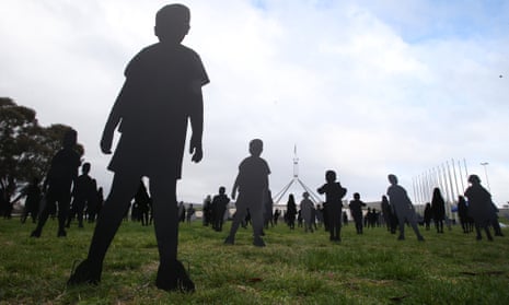 Silhouettes of children on the front lawns of Parliament House, Canberra, to represent asylum seeker children held on Nauru.