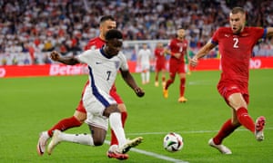Bukayo Saka on the ball for England.