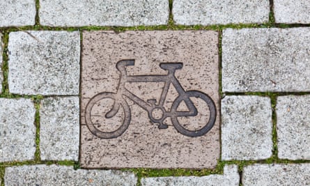 Closeup of a cycle path marker in the pavement