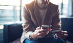 Photo of man making a payment by credit card