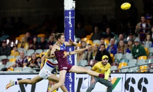 Eric Hipwood of the Lions kicks a goal