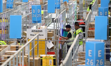 Amazon workers sort packages at an Amazon delivery station  in Alpharetta, Georgia, in November 2022.