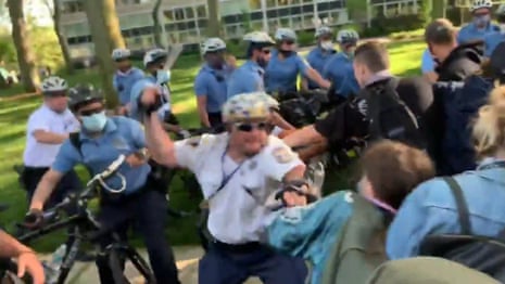 Police officer filmed beating protesters with baton in Philadelphia – video