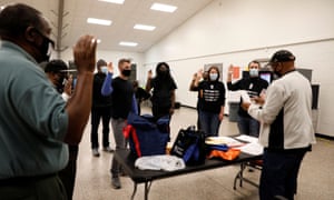 Poll workers take an oath at Fulton County polling station in Atlanta, Georgia.