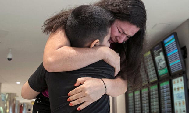 Andy, 7, is reunited with his mother, Arely, at Baltimore-Washington international airport 23 July 2018. They had been separated upon entering the US.