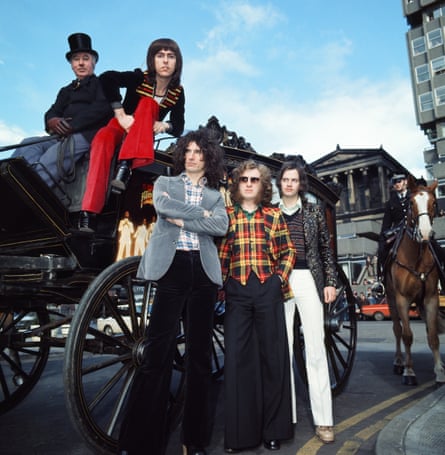 A million miles from Skweeze Me, Pleeze Me … the band promoting the film in 1975.