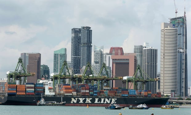 A container ship passes through Singapore harbour