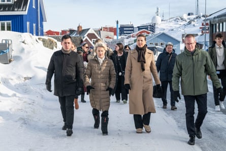 The leaders walking along a snowy road