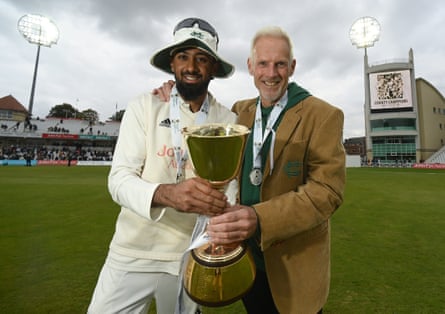 Nottinghamshire captain Haseeb Hameed and coach Peter Moores show off the County Championship trophy.