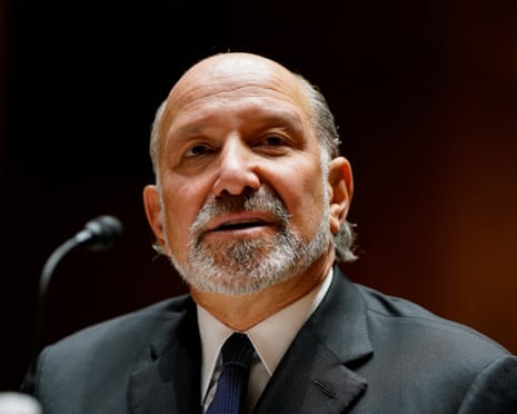 man in suit looks ahead