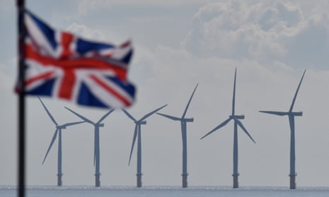 Offshore wind turbines with a Union Jack in the foreground