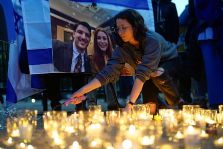 Mourners attend a vigil outside the White House to honour Israel embassy staff members Yaron Lischinsky and Sarah Milgrim, Thursday 22 May 2025.