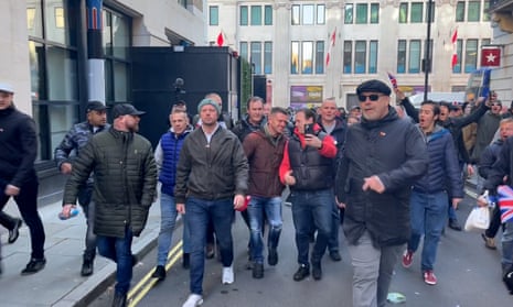 Tommy Robinson, former leader of the English Defence League, walks through London’s Chinatown with a group of other men