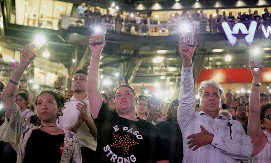 People attend a community memorial service honoring victims of the mass shooting in El Paso.