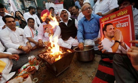 Congress employees perform a special prayer at the party headquarters in Delhi on Thursday.