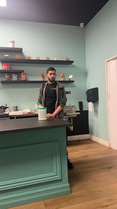 a man standing in a ice cream shop