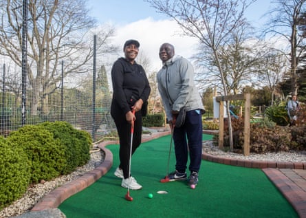 Father and daughter Carl and Shola Easy of Birmingham having a game of crazy golf in Cannon Hill Park.