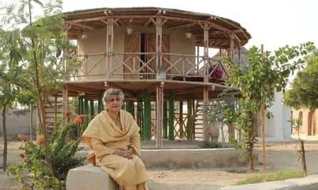 Yasmeen Lari outside the women’s centre on stilts she designed in Sindh province.