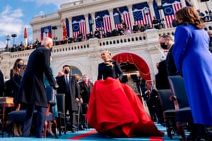 Lady Gaga arriving in a red silk ballgown skirt to perform the National Anthem